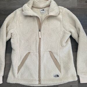 The North Face Women Size S full zip sweater cream color with zipper pockets